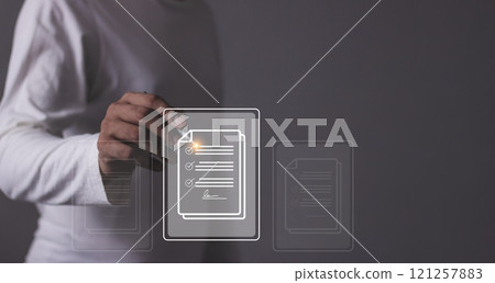 Young man with smartphone mobile hand holding a pen touching to sign a Online business contract 121257883