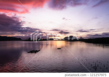 Aerial view sunset sky,Nature beautiful Light Sunset or sunrise over sea,Colorful dramatic majestic scenery sunset Sky with Amazing clouds and waves in sunset sky Aerial view sunset sky,Nature beautiful Light Sunset or sunrise over sea,Colorful dramatic majestic scenery sunset Sky with Amazing clouds and waves in sunset sky 121257973