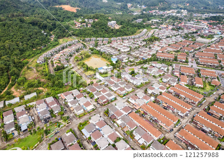 New development real estate. Aerial view of residential houses and driveways neighborhood during a fall sunset or sunrise time. Tightly packed homes. Top view over private houses in phuket thailand 121257988