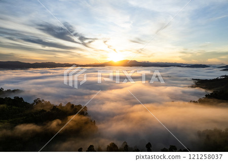Amazing Sunrise or sunset over mountains hills covered with mist, Aerial view landscape drone shot beautiful colorful nature background 121258037