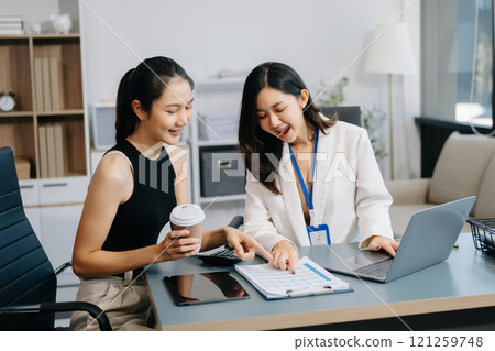Two businesswoman and man discuss investment project working and planning strategy with tablet laptop computer Two businesswoman and man discuss investment project working and planning strategy with tablet laptop computer 121259748