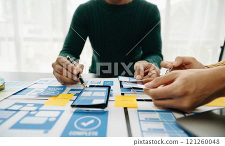 UX graphic designer planning application process development prototype wireframe for web smart phone. 121260048