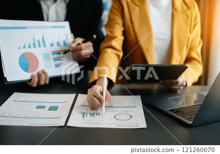 Business team meeting present.professional investor working with  Finance managers task. with laptop smart phone and tablet 121260070