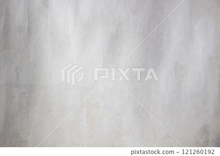 Textured paper background. The paper is covered with a thin layer of white paint. Textured paper background. The paper is covered with a thin layer of white paint. 121260192