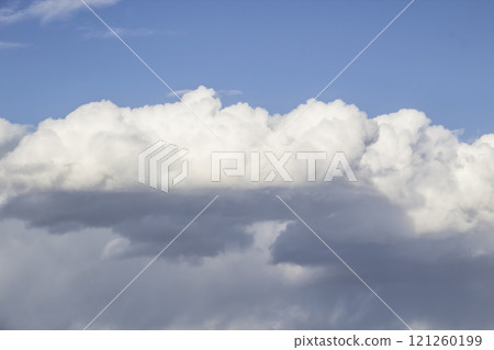 Cloud in the blue sky. A beautiful clouds against the blue sky background. Beautiful cloud pattern in the sky. Cloud in the blue sky. A beautiful clouds against the blue sky background. Beautiful cloud pattern in the sky. 121260199