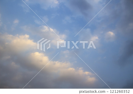 Clouds in the blue sky. A beautiful clouds against the blue sky background. Beautiful cloud pattern in the sky. 121260352