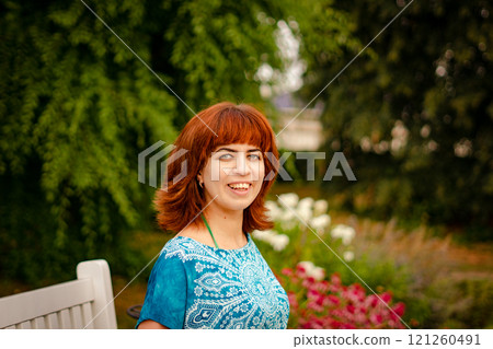 The girl with the red hair in the leaves The girl with the red hair in the leaves 121260491