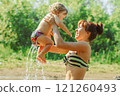 mom and child swim in the river 121260493