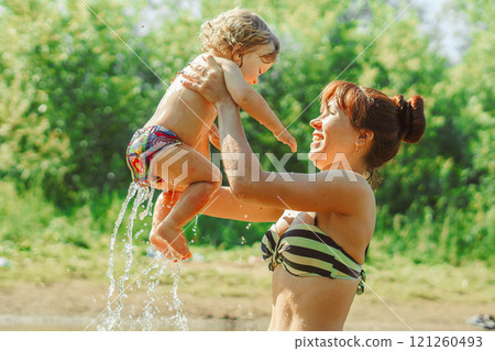 mom and child swim in the river mom and child swim in the river 121260493