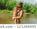 mom and child swim in the river 121260495
