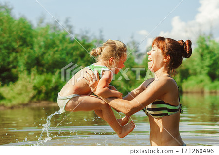 mom and child swim in the river mom and child swim in the river 121260496