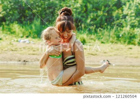 mom and child swim in the river mom and child swim in the river 121260504