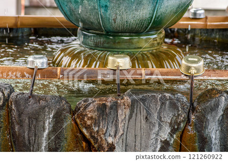 Water fountain in Yakushi-ji temple, one of the most famous Buddhist temples in Japan, built in 680 AD in Nara, Japan Water fountain in Yakushi-ji temple, one of the most famous Buddhist temples in Japan, built in 680 AD in Nara, Japan 121260922