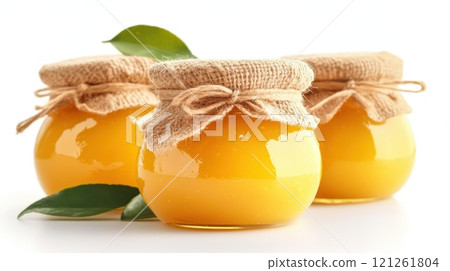 Fresh lemon curd in glass jars covered with burlap Fresh lemon curd in glass jars covered with burlap 121261804