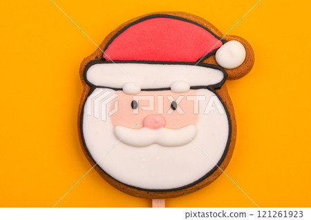 Santa Claus gingerbread cookie on yellow background Santa Claus gingerbread cookie on yellow background 121261923
