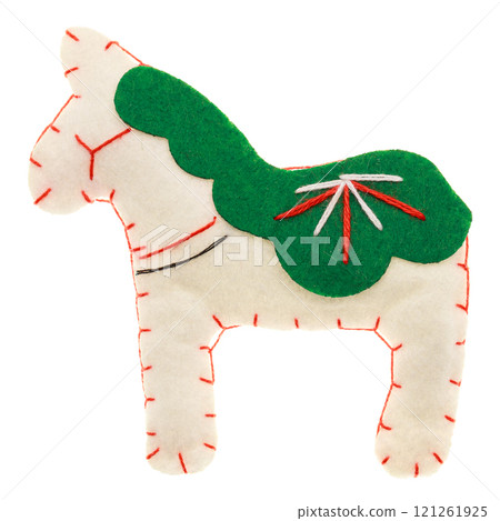 Handmade white and green felt horse toy with embroidery details isolated on white Handmade white and green felt horse toy with embroidery details isolated on white 121261925