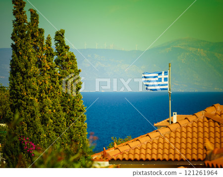 Greek flag on roof top of home Greek flag on roof top of home 121261964
