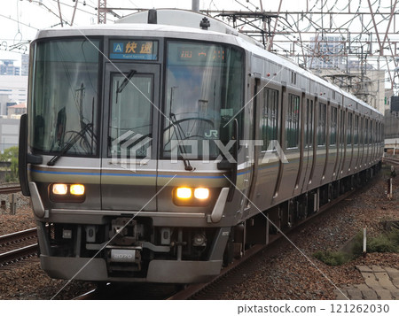 Series 223 Rapid train bound for Kakogawa (W36) passing through Tsukamoto Station Series 223 Rapid train bound for Kakogawa (W36) passing through Tsukamoto Station 121262030