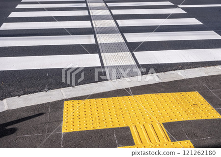 Crosswalk with braille blocks 121262180