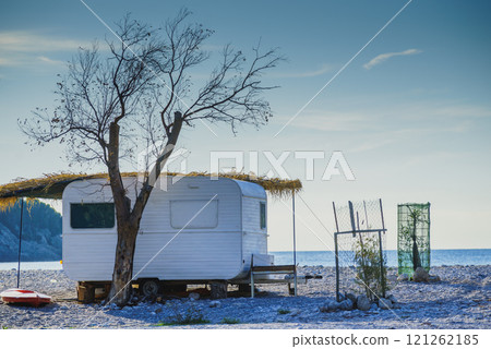 Caravan trailer on sunny beach Caravan trailer on sunny beach 121262185