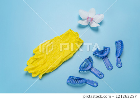 Latex gloves and dental pliant impression trays. 121262257