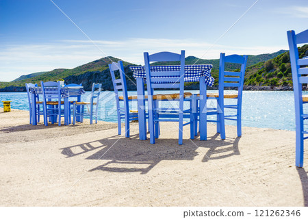 Open cafe outdoor restaurant in Greece on sea shore Open cafe outdoor restaurant in Greece on sea shore 121262346
