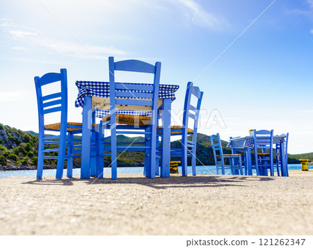 Open cafe outdoor restaurant in Greece on sea shore Open cafe outdoor restaurant in Greece on sea shore 121262347