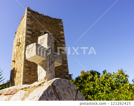 Greek stone cross and tower house, Greece 121262425