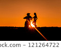 Silhouette of a girl and a man on a motorcycle.  121264722