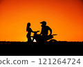 Silhouette of a girl and a man on a motorcycle.  121264724