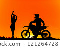 Silhouette of a girl and a man on a motorcycle.  121264728