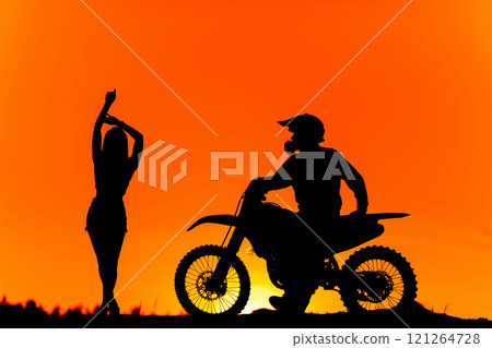 Silhouette of a girl and a man on a motorcycle.  121264728