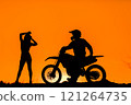 Silhouette of a girl and a man on a motorcycle.  121264735