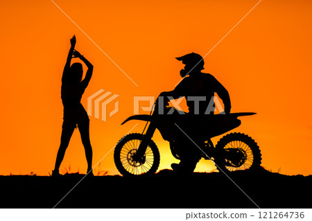 Silhouette of a girl and a man on a motorcycle. Silhouette of a girl and a man on a motorcycle. 121264736