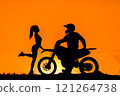 Silhouette of a girl and a man on a motorcycle.  121264738