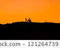 Silhouette of a girl and a man on a motorcycle.  121264739
