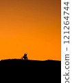 Silhouette of a girl and a man on a motorcycle.  121264744