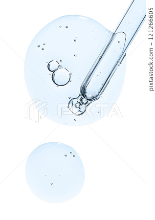 Pipette and drops of cosmetic serum for the skin. Liquid body care product. Isolated on a white background. Pipette and drops of cosmetic serum for the skin. Liquid body care product. Isolated on a white background. 121266605