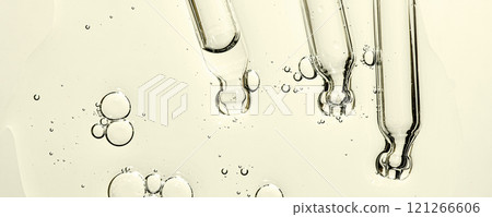 Three pipettes and a serum texture for skin with bubbles. Liquid body care product. Closeup. Three pipettes and a serum texture for skin with bubbles. Liquid body care product. Closeup. 121266606