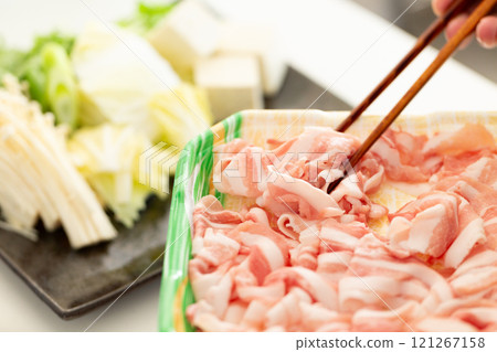 A man preparing ingredients for shabu-shabu A man preparing ingredients for shabu-shabu 121267158