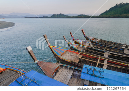 Close up Small fishing boats anchored in the sea 121267364