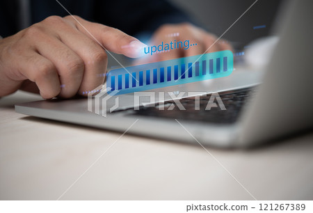 Close up of hand updating software on laptop digital progress bar technology concept Close up of hand updating software on laptop digital progress bar technology concept 121267389