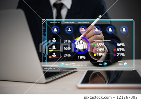 Businessman using futuristic virtual interface with data analytics and human resource management dashboard Businessman using futuristic virtual interface with data analytics and human resource management dashboard 121267392