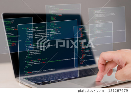 Hands typing on laptop with programming code on screen, representing software development. Perfect for coding, IT solutions, digital technology, web applications. Hands typing on laptop with programming code on screen, representing software development. Perfect for coding, IT solutions, digital technology, web applications. 121267479
