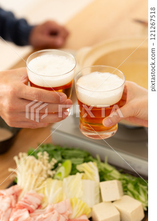 A middle-aged couple enjoying pork shabu-shabu hotpot 121267518