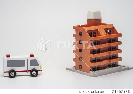 Image of an ambulance rushing to an apartment building Image of an ambulance rushing to an apartment building 121267578