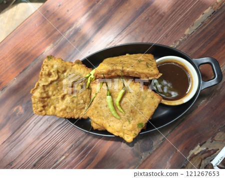 Golden brown Tempe Mendoan, a crispy Indonesian snack 121267653