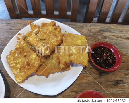 Golden brown Tempe Mendoan, a crispy Indonesian snack 121267682
