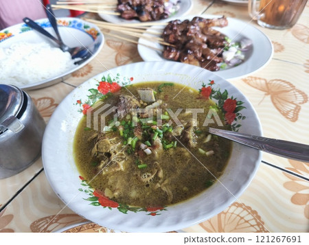 A bowl of steaming gulai kambing, an Indonesian goat soup. A bowl of steaming gulai kambing, an Indonesian goat soup. 121267691