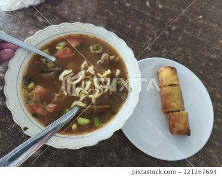 A bowl of warm, comforting Soto Mie, Noodle soup. 121267693
